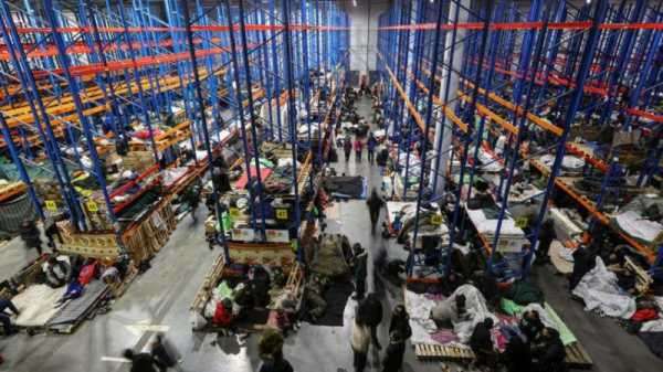 Migrants camped in Belarus warehouse still hope to get to EU | INFBusiness.com