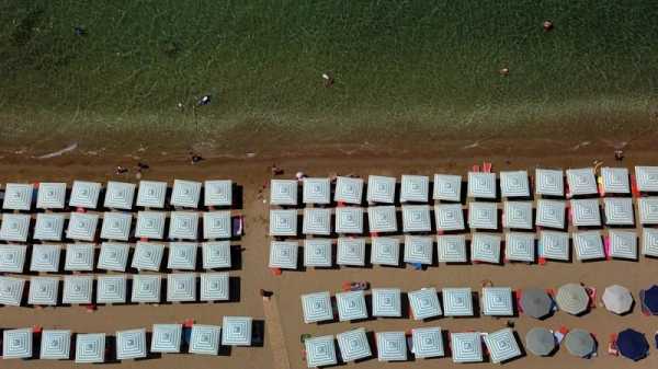 Greeks protest for space on the beach as pricey sunbeds multiply | INFBusiness.com