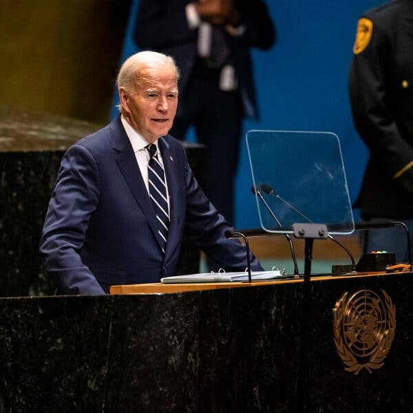 Joe Biden speaking at a lectern.