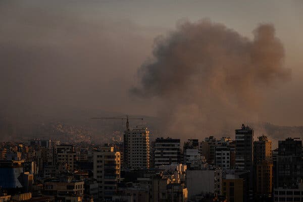 Smoke rises from buildings. 