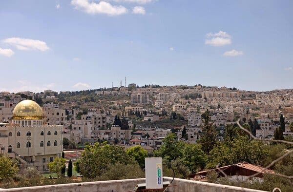 A hillside covered with buildings.