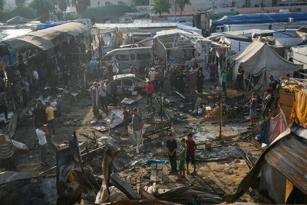 A view from above of charred and damaged shelters.