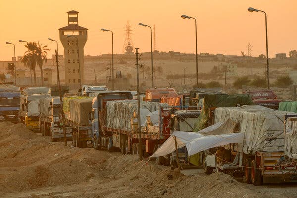 A line of trucks carrying supplies.