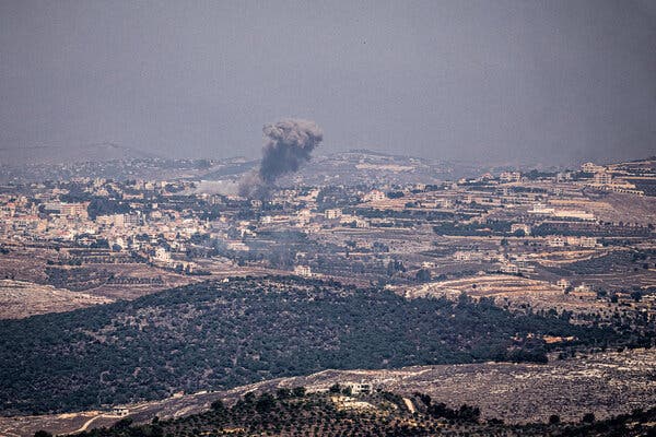 A plum of smoke rising from buildings in southern Lebanon. 