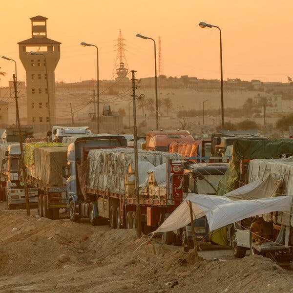 A line of trucks carrying supplies.