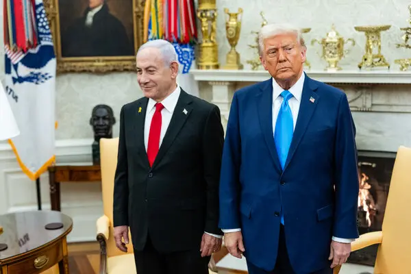 Israeli Prime Minister Benjamin Netanyahu and President Trump stand side by side in the Oval Office.