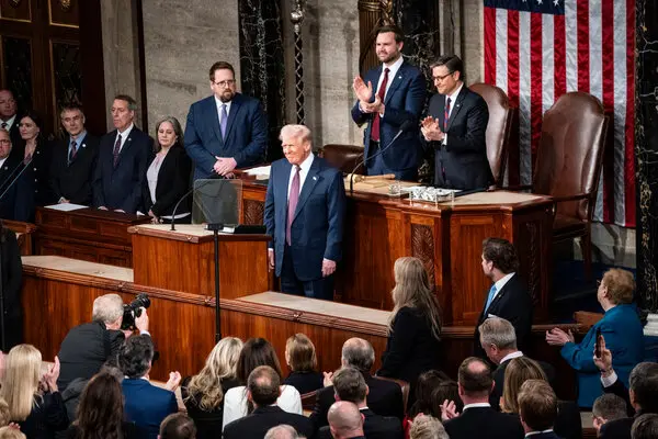 President Trump stands at the lectern during his address to a joint session of Congress.